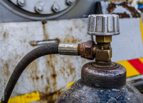gas oxygen cylinders close up / a welding gas cylinder pressure gauge / gas cylinder valve / Scuba air tanks with valves / Pressurized gas cylinder,CO2 gas venting to release pressure