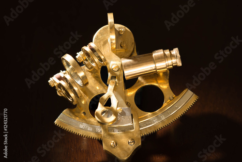 Vintage sextant on black background