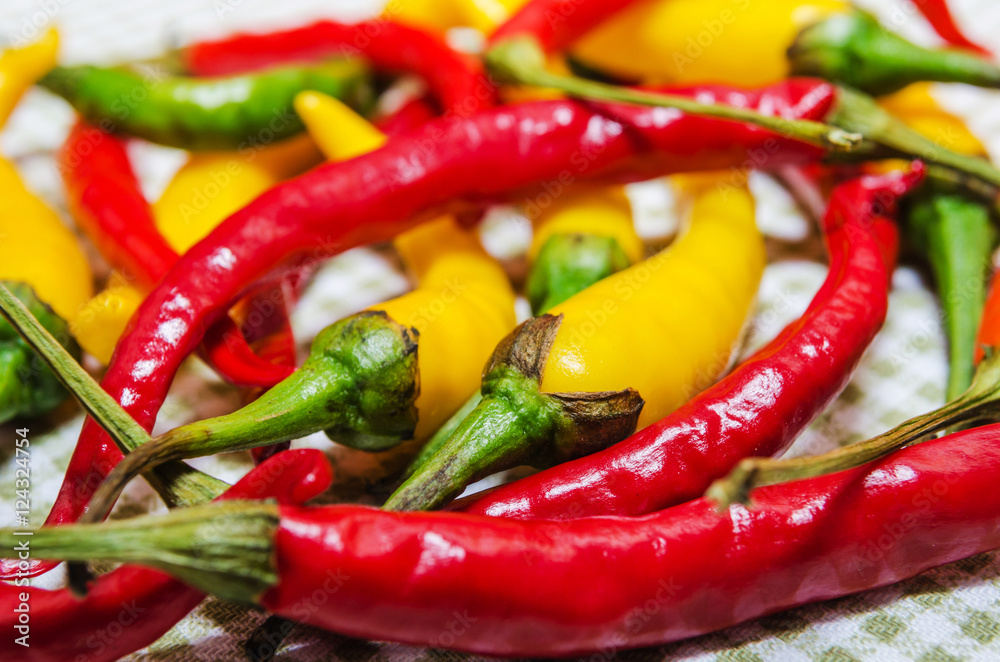 close-up of red and yellow peppers on napkin
