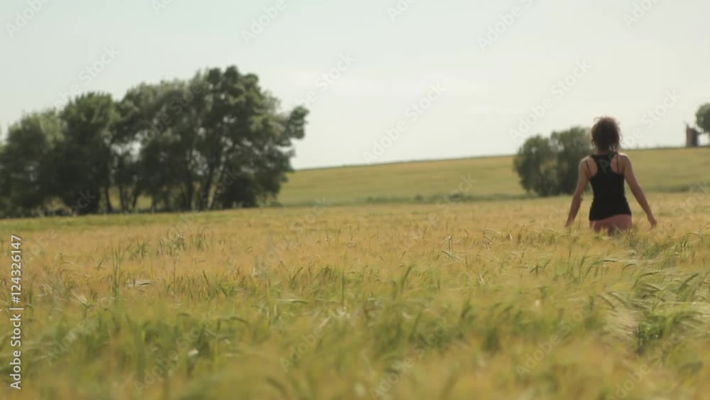young attractive woman walking on wheat field with fresh crops summer season farm ecological pure healthy lifestyle concept young attractive woman walking on wheat field with fresh crops summer season farm ecological pure healthy lifestyle concept