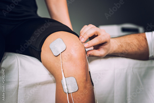 Electro stimulation used to treat knee pain photo