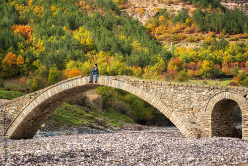 Autumn forest /
Amazing view with old bridge and a woman enjoying the autumn forest in Eastern Rhodopes, Bulgaria