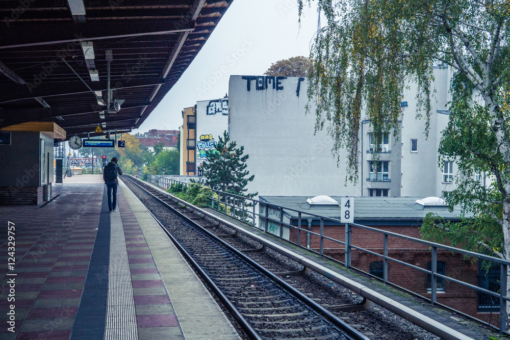 Person waiting on a train platform