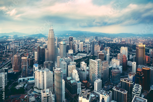 Kuala lumpur city skyline in evening  Kuala lumpur is capital city of malaysia  Business district area in Kuala lumpur  Malaysia  Vintage color tone.