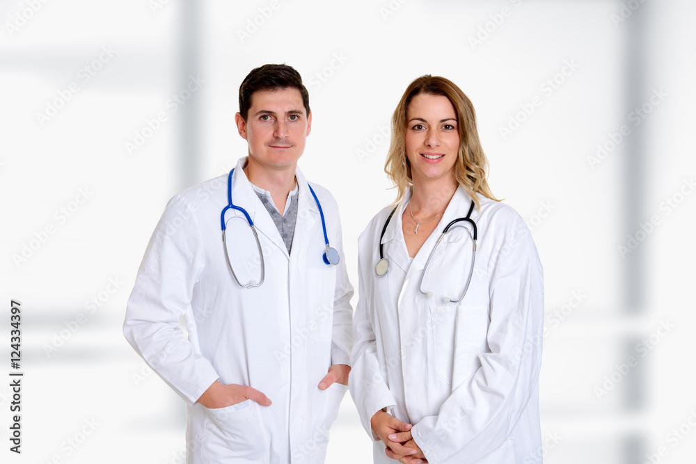 young friendly medical team with book in lab coat young friendly medical team with book in lab coat
