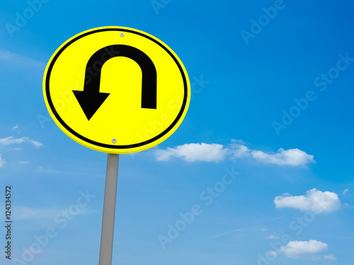 Round Yellow Road Sign U-Turn Against A Cloudy Sky, 3d illustration