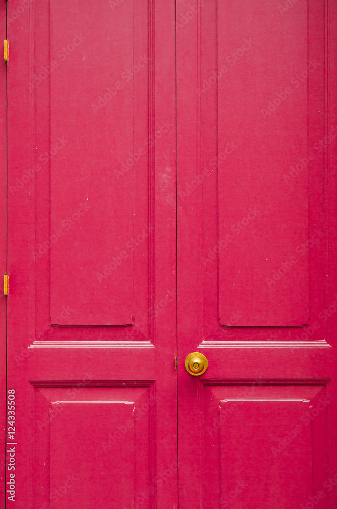 Fototapeta premium Door knob golden color with pink, door background