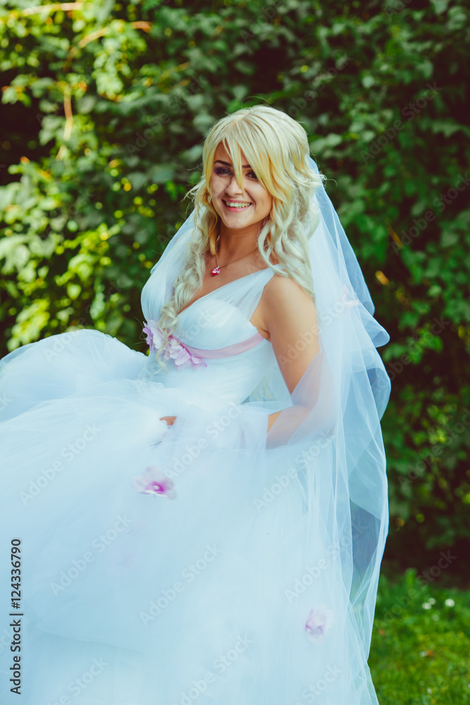 Blonde hair strands lie over the face of attractive bride Blonde hair strands lie over the face of attractive bride