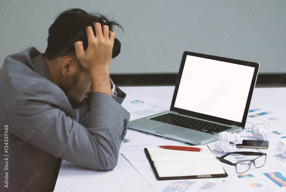 Businessman having stress over laptop in the office Businessman having stress over laptop in the office