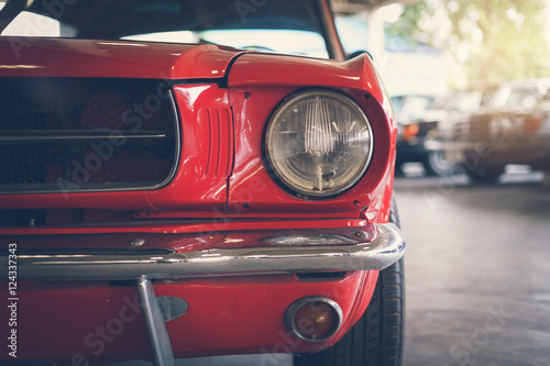 Close up headlight of red Retro classic car © Kittiphan