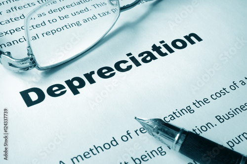 Paper with sign Depreciation and a pen. Business concept. photo