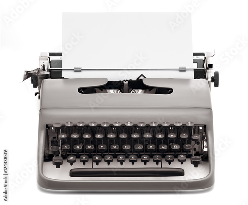 vintage typewriter with blank paper to type on