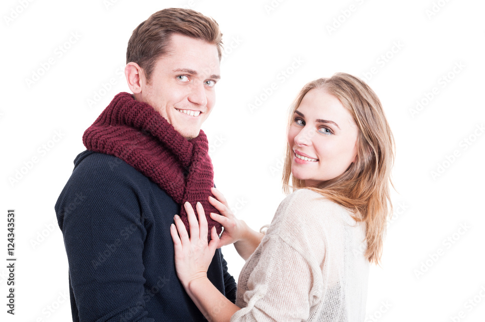 Woman posing and arranging man's autumn casual neckcloth Woman posing and arranging man's autumn casual neckcloth