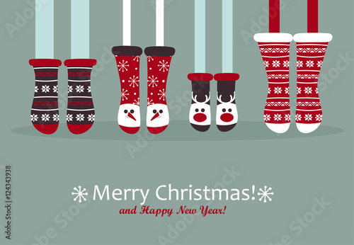 Family feet in Christmas socks.