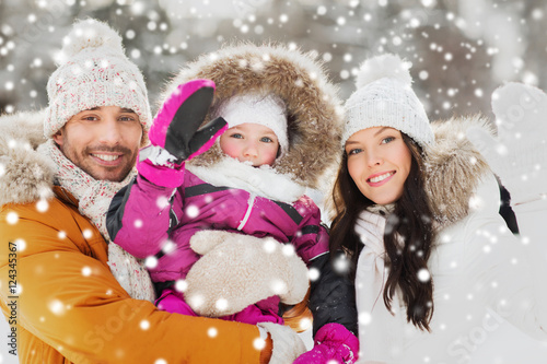 happy family waving hands outdoors in winter