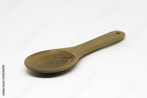 Wooden spoon with on white background.