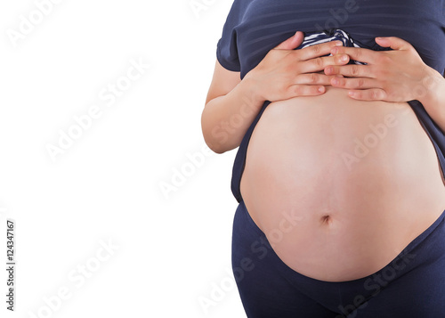 pregnant woman touching her belly