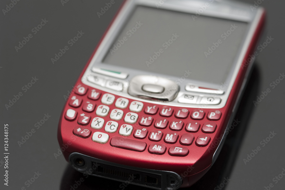 Closeup of a fancy shiny red mobile phone Closeup of a fancy shiny red mobile phone