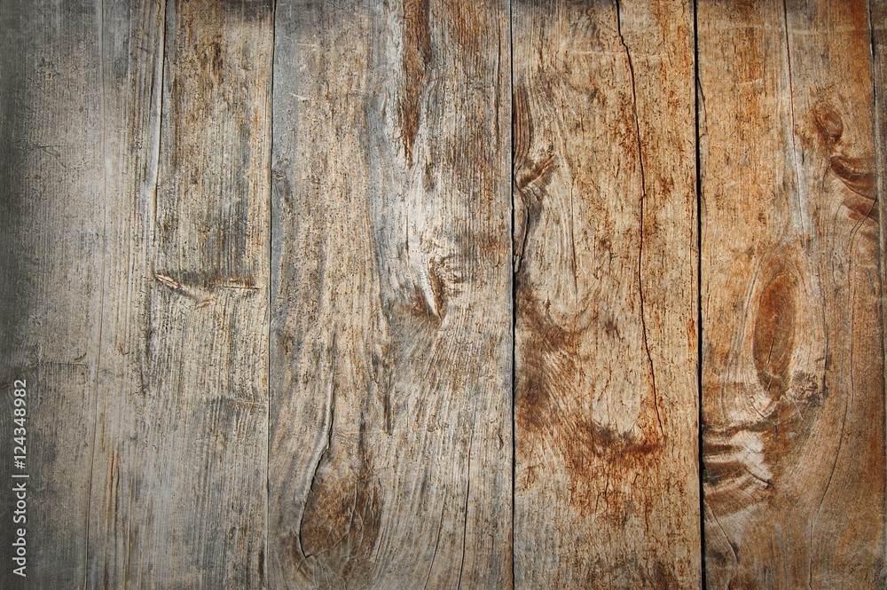 Naklejka premium Old wooden fence. wood palisade background. planks texture
