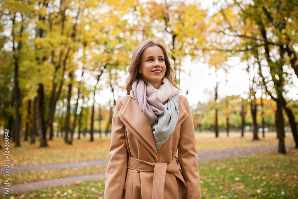 beautiful happy young woman walking in autumn park beautiful happy young woman walking in autumn park
