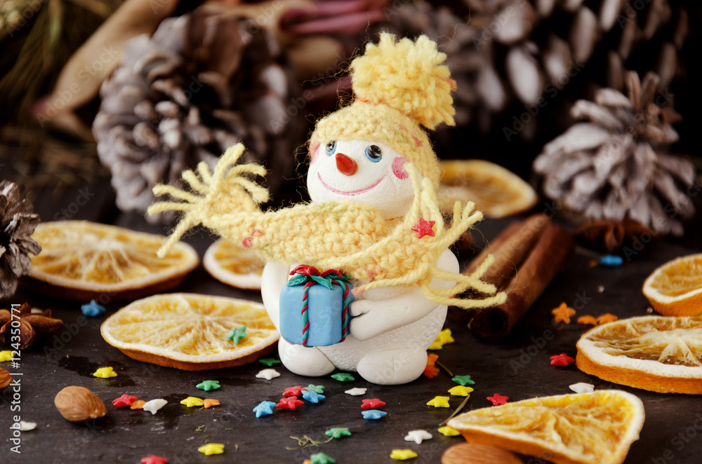 figurine Snowman on Christmas BACKGROUND , selective focus