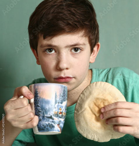 boy with tortillia and milk photo