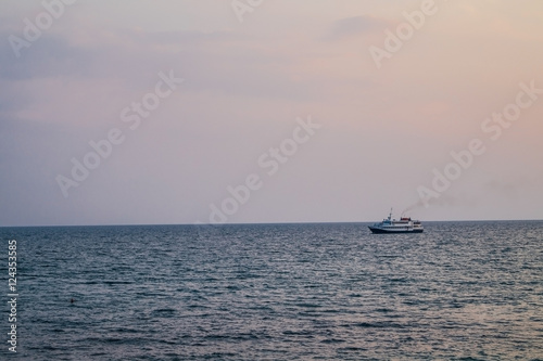 The ship in the evening calm sea