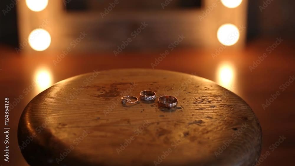 wedding rings on a wooden table Stock Video | Adobe Stock
