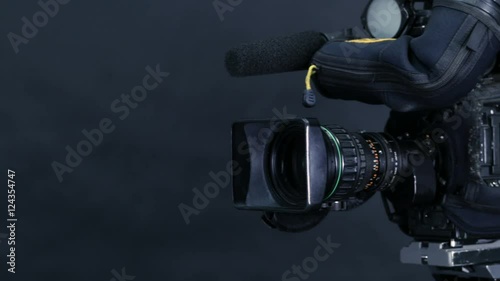 Studio broadcasting camera isolated on black background. 4K. photo