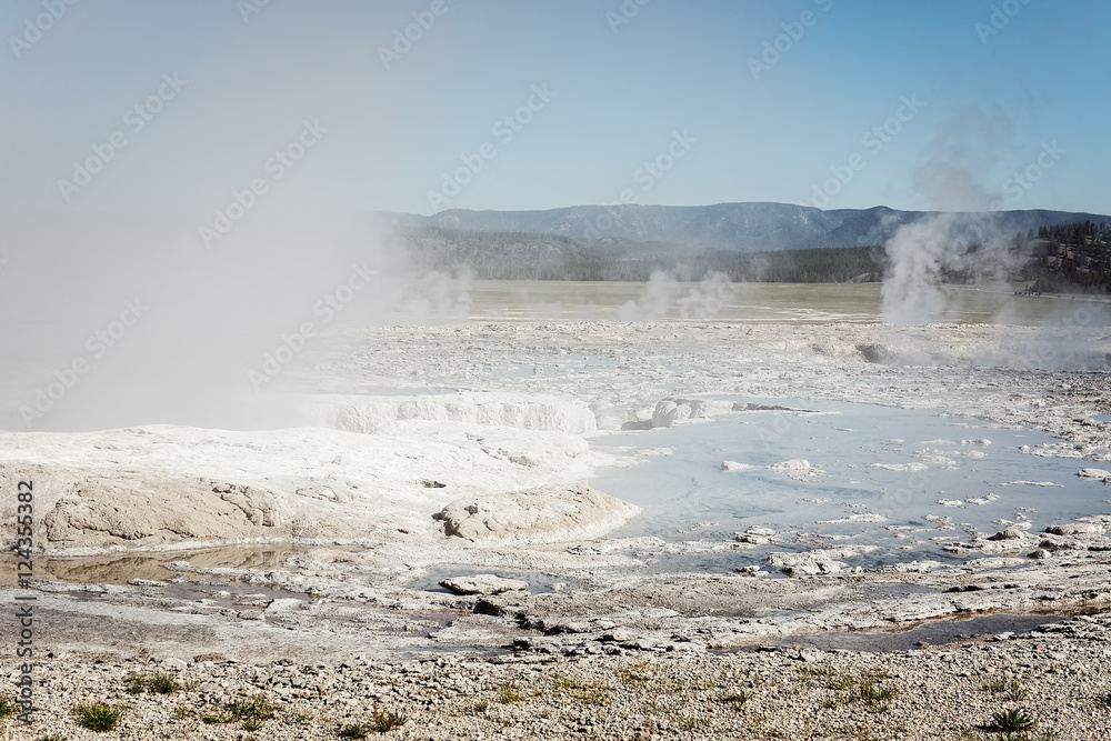 Early morning and steam rises across the Lower Geyser Basin in Yellowstone Park