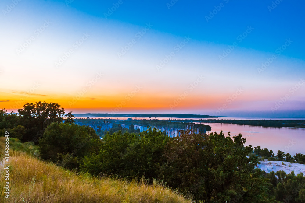 View from the hill to the Dnieper and the evening urban landscape on the bank. Ukraine