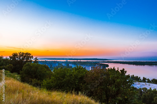 View from the hill to the Dnieper and the evening urban landscape on the bank. Ukraine