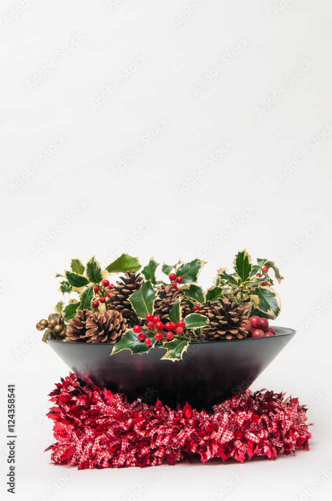 Fototapeta premium Festive Christmas decoration with holly and ivy on a white background