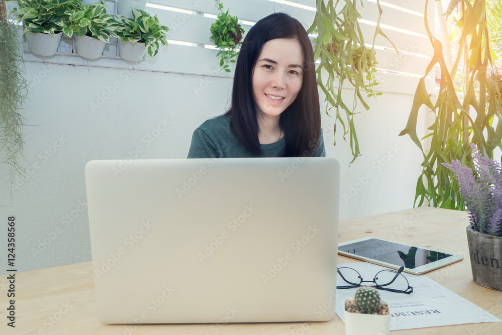 Office table with laptop and blank screen on laptop, Asian woman Office table with laptop and blank screen on laptop, Asian woman