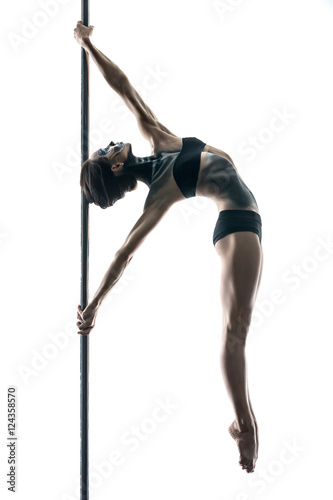 Female pole dancer with body-art on pylon