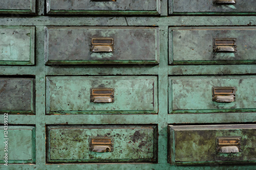 Green drawers of a workshop full of patina 