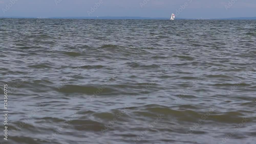 Isolated sailboat at sea, establishing shot. Isolated sailboat at sea, establishing shot.