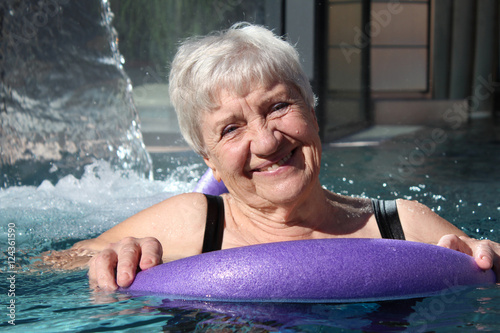 senior woman swimming in a pool
