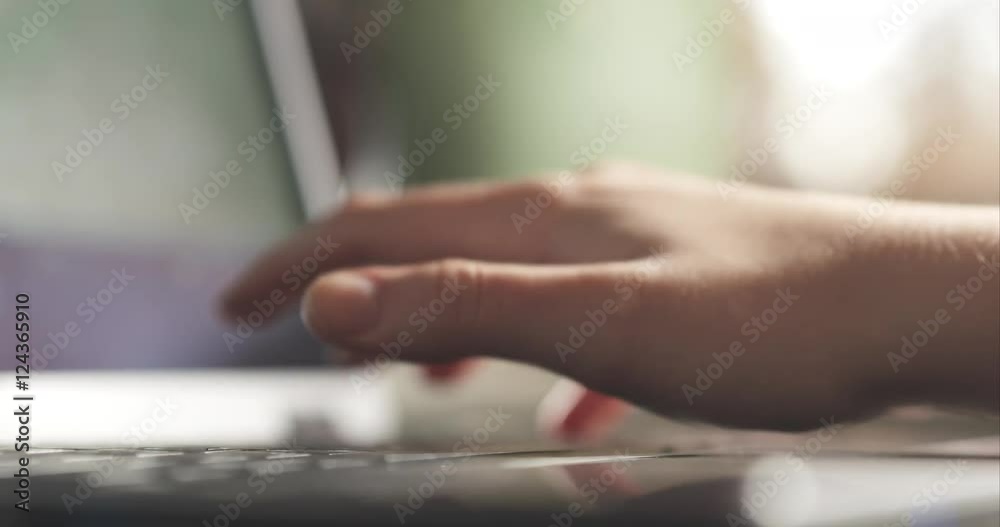 young female hands using notebook on a table in cafe young female hands using notebook on a table in cafe
