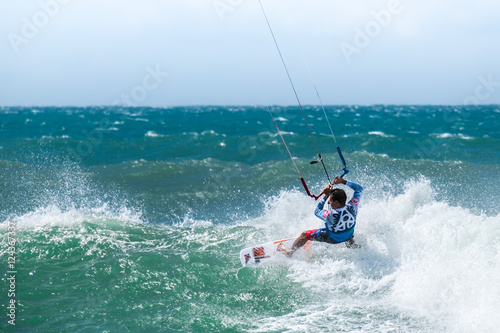 Amazing kite surfing at Philippines. Processional instructor surfing in ocean waives