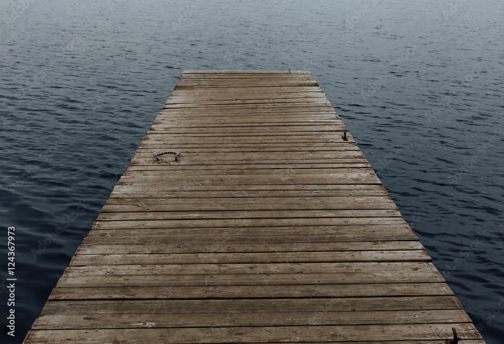 old wooden jetty on a lake