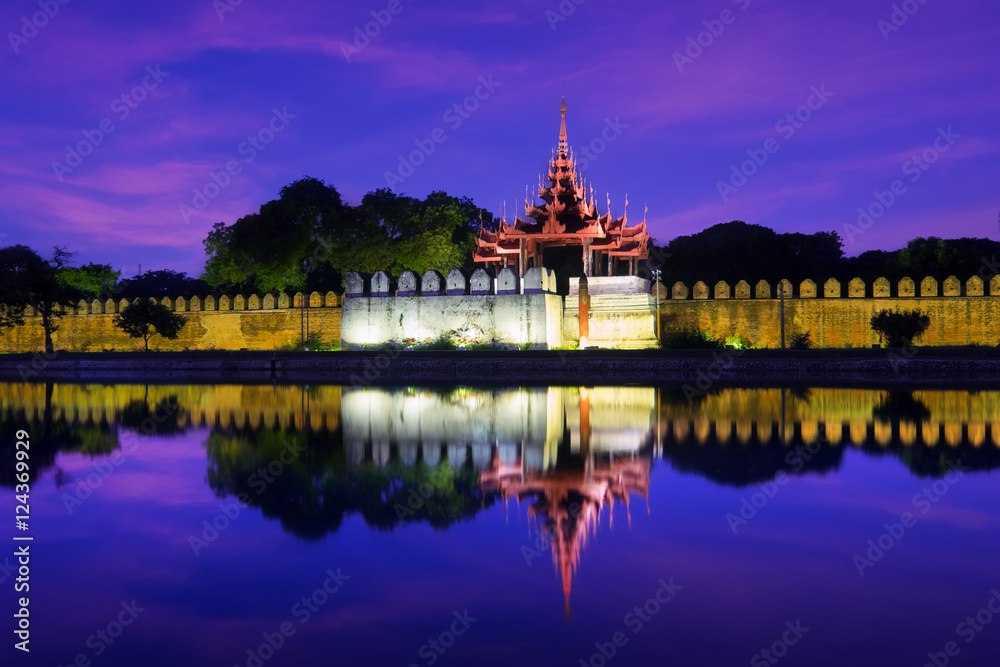 Night view of Mandalay cityscape with famous Fort or Royal Palace. Myanmar (Burma) travel landscapes and destinations