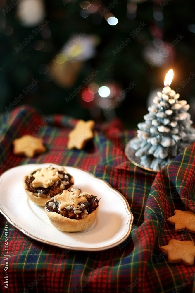Christmas pastry filled with apples, almonds and chocolate with star shaped cookies. Selective focus and festive background.
Christmas pastry filled with apples, almonds and chocolate with star shaped cookies. Selective focus and festive background.