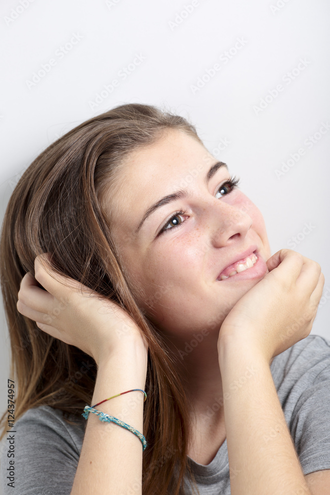 Portrait of adolescent touching the hair. Portrait of adolescent touching the hair.