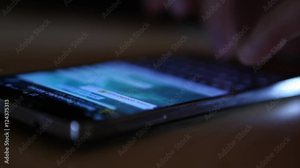 generic brand mobile phone texting typing reading scrolling watching pictures close up modern technology smartphone