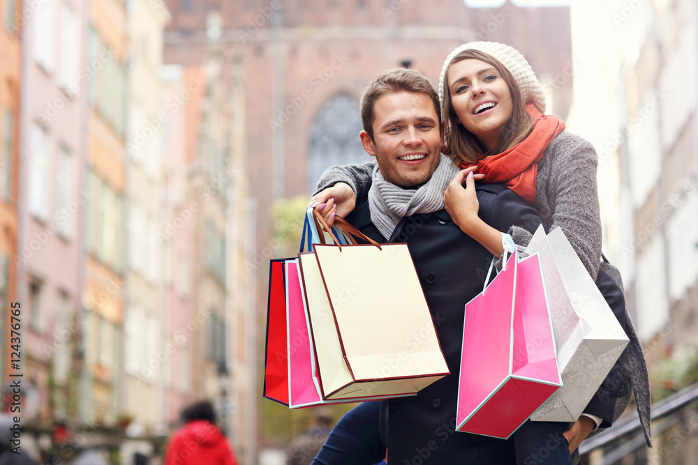 Happy couple shopping in the city Happy couple shopping in the city