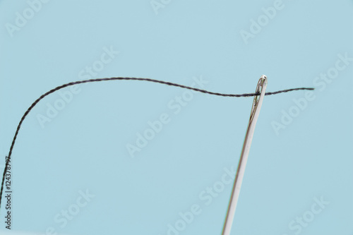 Close Up of Threaded Sewing Needle