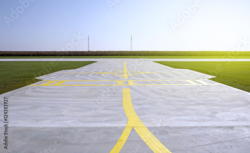 Yellow lines on a runway of small airport
