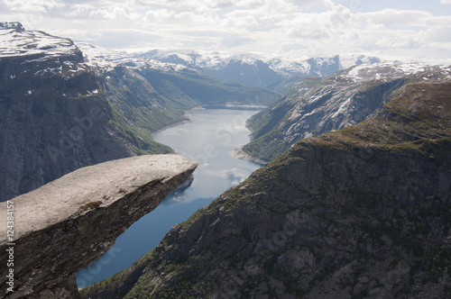 Norway, Trolltunga. Trolltunga is a piece of rock jutting horizontally out of a mountain about 700 metres above the north side of the lake Ringedalsvatnet, Norway.
