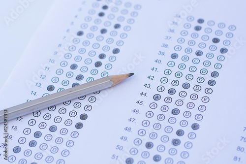 Standardized test form with answers bubbled in and a pencil